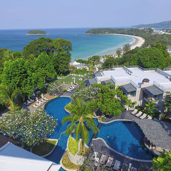 Nestled among lush tropical gardens, the beach resort offers Thai-style villas, a three-tiered hillside pool, and sweeping views of Kata Beach and the Andaman Sea